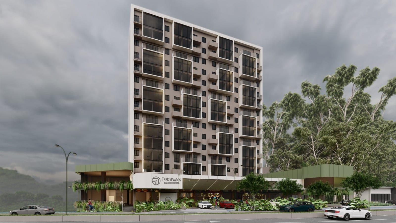 Vista exterior de Tres Nevados Reserva, con la torre residencial, el bulevar comercial y la vegetación del conjunto.