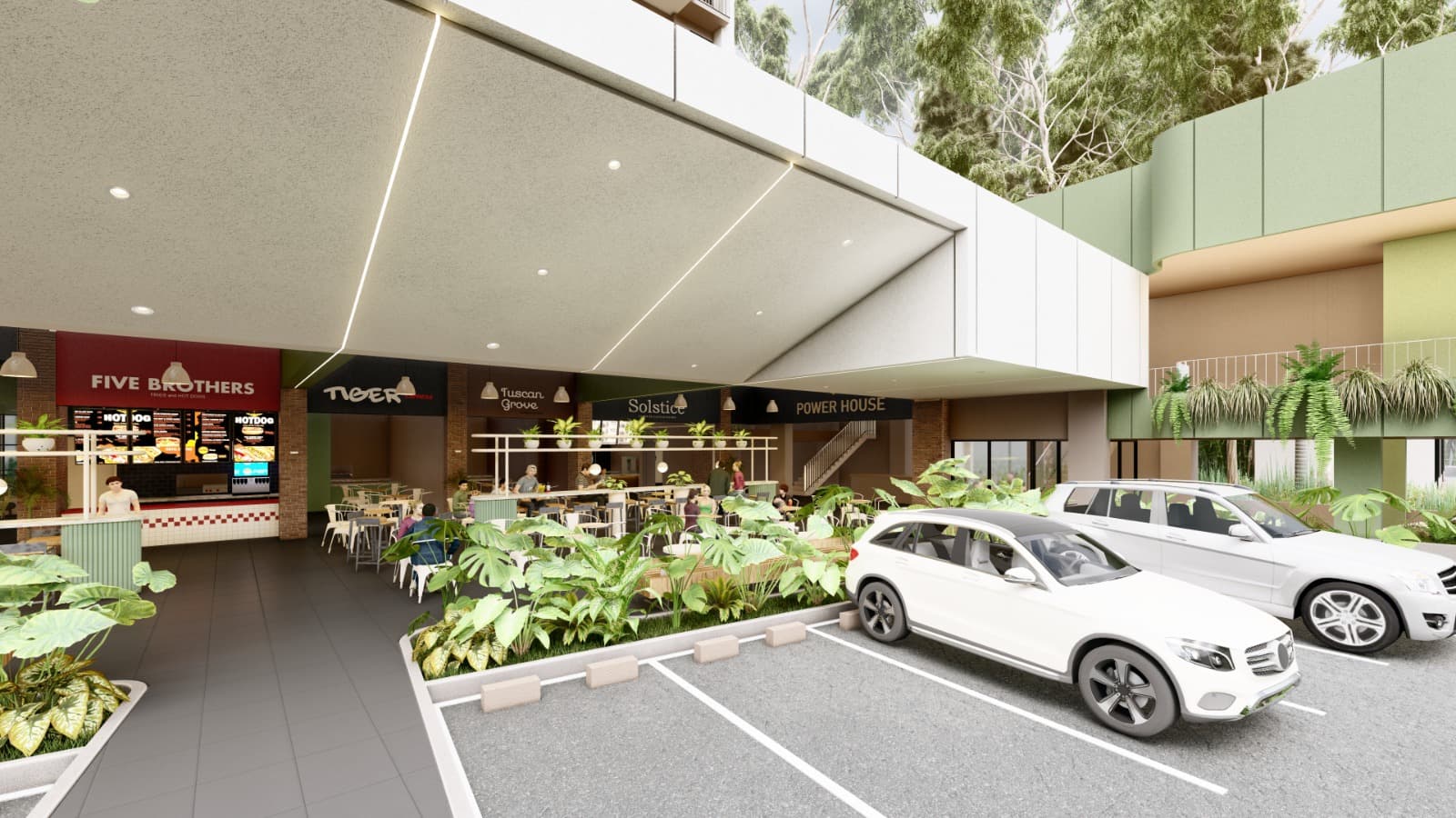 Plazoleta comercial exterior con locales y vegetación.